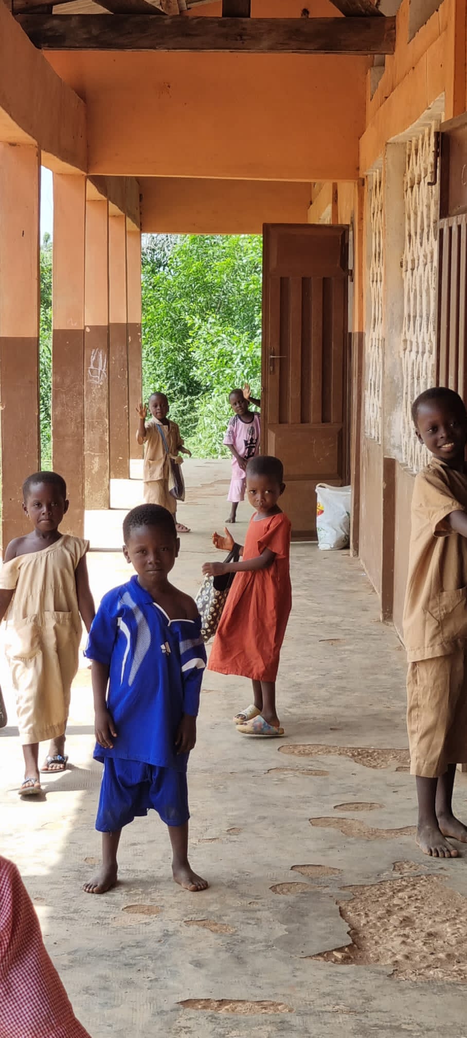 Children in a school corridor in the village